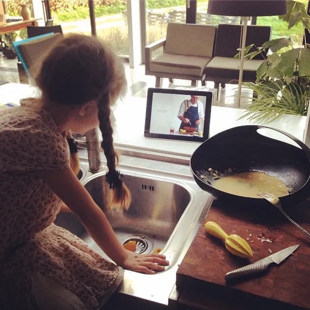 A father and his young daughter making The Best Caesar together in their kitchen